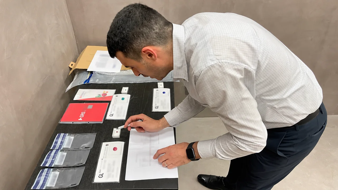 Abi Kidadi checks received valuables against their records